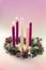 Traditional christian religious advent wreath with 5 candles, two candles burning