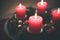 Traditional Christmas decoration: Advent wreath with red lights