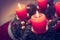 Traditional Christmas decoration: Advent wreath with red lights