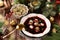 Traditional Christmas Eve red borscht with dumplings filled with mushrooms and sauerkraut top view