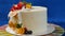 Traditional Christmas fruit cake with white frosting and sugared fruits. Cream cake with kumquat, cranberries