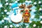 Traditional, Christmas, ginger gingerbreads, cookies a deer and a snowman close up on a blue background with fir-tree branches