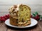 Traditional Christmas Panettone. Famous Italian dessert isolated on wooden background