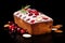 Traditional christmas pound cake decorated with sugar and cranberries on black background