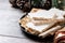 Traditional Christmas sweet, pieces of delicious almond nougat on wooden table