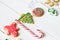 Traditional Christmas sweets on white wooden background. Candy cane, round snowflake and ginger man, star lollipop. Top