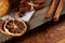 Traditional Christmas tea concept with dried oranges, cookies and decorations on a wooden table, selective focus