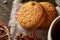 Traditional Christmas tea concept with dried oranges, cookies and decorations on a wooden table, selective focus