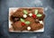 Traditional Christmas Yule Log cake decorated with chocolate holly mushrooms cookie