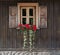 Traditional classic European wooden facade with window shutters