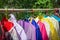 The Traditional clothes in hanger hang on a bamboo shelf. The Shirt hang on bamboo shelf