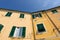 Traditional colors of the house, walls, doors, windows. Italy