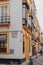 Traditional colourful buildings on the corner of Javier Lasso De La Vega street in Seville, Spain