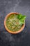 Traditional Columbian chimichurri sauce aji criollo with chili, coriander and garlic in a bowl