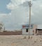 A traditional computer fork buildings and power line pole Thar Desert Jaisalmer RajasthanIndia