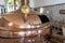 Traditional copper distillery tanks in a beer brewery