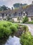 Traditional cotswold stone cottages built of distinctive yellow limestone in the famous Arlington Row, Bibury Gloucestershire UK