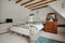 Traditional cottage bedroom with sloping ceiling