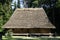 Traditional cottage houses with the straw roofs. Ukraine