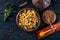 Traditional couscous in a tajine, shot from the top with spices and herbs