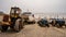 Traditional crab fishing boats and tow tractor on the beach