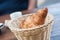 Traditional croissant in a wooden basket  on wooden table