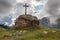 Traditional cross at mountain top in the Swiss Alps