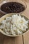 Traditional Cuban cuisine, black beans and rice in two clay bowls