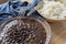 Traditional Cuban cuisine, black beans and rice in two clay bowls