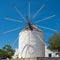 Traditional cycladic windmill at day time on Paros island