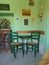 Traditional Cypriot Greek corner with wooden chairs and metal small table