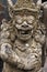 Traditional demon guards statue in Bali island. Religion.