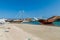 Traditional dhow boat yards in Sur, Oman. Khor al Batar bridge in the backgroun