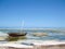 A traditional dhow sailboat resting in the Indian Ocean on the island of Zanzibar, Tanzania, Africa