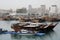 Traditional dhows moored up by Doha corniche