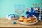 Traditional donuts close up for Jewish Holiday Hanukkah on wooden table