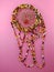 Traditional dreamcatcher made by an Indian from Canada on a pink background