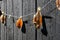 Traditional dried fish on a line with a background of black tarred wood