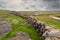 Traditional dry stone fences and patches of green grass. Landscape of Inishmore Aran islands, county Galway, Ireland. Beautiful