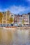 Traditional Dutch Cityscape Of Amsterdam With Barge in the Foreground At Daytime