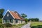 Traditional dutch house in the landscape of Texel island