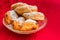 Traditional dutch oliebollen and appelflappen in a glass bowl