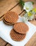 Traditional Dutch Stroopwafels in setting with flowers
