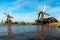 Traditional dutch windmills located by the river Zaan, in Zaanse Schans, Netherlands