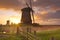 Traditional Dutch windmills at sunrise