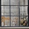 the Traditional Dutch window with tulle and dry bouquets on the windowsill