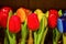 Traditional Dutch Wooden painted colorful tulips in souvenir shop