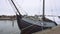 Traditional Dutch Wooden Yachts at Cloudy Spring Weather are Moored in Marken, Netherlands. Electrical outlets to charge
