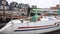 Traditional Dutch Wooden Yachts at Cloudy Spring Weather are Moored in Marken, Netherlands. Electrical outlets to charge