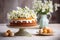 Traditional Easter bread cake decorated with spring flowers on morning table with easter eggs.
